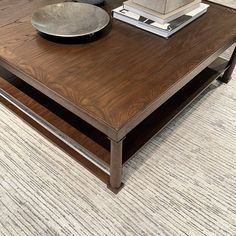 a coffee table with a bowl on top