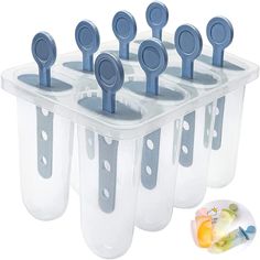 six plastic storage containers with spoons in them