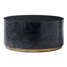 a black and gold coffee table with an oval top on the bottom, in front of a white background