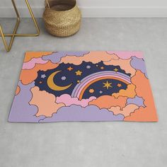 an area rug with clouds, stars and a rainbow in the sky on concrete flooring