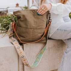 This Versatile Bag Can Work As A Crossbody Or Shoulder Bag. The Bag Comes With A Removable Pu Leather Shoulder Strap And A Canvas Crossbody Strap. Features A Magnetic Closure And 2 Front Pockets To Keep Your Contents Safe! The Interior Features A Black Nylon Lining With A Small Zipper Pocket. Body: 12" X 15" X 4" Pu Leather Shoulder Strap: 27" Canvas Crossbody Strap: 27-48" Width: 2" The Canvas Strap Is More Lightweight Than Our Original Canvas Straps, With Embroidery On One Side. Main Material: Green Canvas Shoulder Bag For On-the-go, Green Canvas Bag With Adjustable Strap For On-the-go, Green Hobo Bag With Leather Handles For On-the-go, Green Canvas Bag With Leather Handles For On-the-go, Green Shoulder Bag With Adjustable Strap For On-the-go, Daily Use Khaki Bucket Bag With Adjustable Strap, Khaki Bucket Bag With Removable Pouch For Travel, Khaki Bucket Shoulder Bag With Adjustable Strap, Khaki Bucket Bag With Adjustable Strap