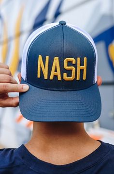 Design Curved brim, adjustable hat Six-panel construction Embroidered eyelets for added ventilation Style Features embroidered graphic at front crown Additional Details One size fits most Hockey Season, Adjustable Hat, Brand You, Navy And White, Nashville, Fun Sports, White Gold, Crown, Navy