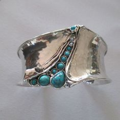 Unique Design by AMIR PORAN: Sterling Silver Wide Cuff Bracelet with Gemstone Wedding Gift  Max Width: 1.57 inches. Length: 6.2 inches Can be made to fit any wrist MATCHING RING! https://www.etsy.com/il-en/listing/212541112/sterling-silver-long-stylish-garnet-ring?ref=shop_home_active_67&pro=1&frs=1 Please let me know if have any questions. our jewelry shop on Etsy:  http://www.etsy.com/shop/Porans Thank you for visiting our shop. Please visit my shop policies for additional information Big Stone Rings, Silver Statement Jewelry, Bohemian Bracelet, Silver Bracelets For Women, Wide Cuff Bracelets, Bohemian Bracelets, Garnet Ring, Funky Jewelry, Sterling Silver Cuff Bracelet