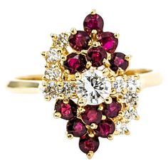 Pigeon Blood Red Ruby & Diamond Waterfall Ring Introducing this beautiful Ruby Gemstone Cocktail Ring, expertly crafted in 18k yellow gold. The ring showcases a stunning .57ctw deep red color rubies. Rubies hold a special significance as the birthstone for July, symbolizing passion, protection, and prosperity; the rubies in displayed in this stunning ring are excellet quality! Complementing the vibrant ruby are .58ctw round diamonds in a mesmerizing waterfall design, evoking a sense of graceful Luxury Cluster Ruby Ring, Luxury Ruby Cluster Ring With Center Stone, Cluster Diamond Ring With Vvs Clarity And Ruby, Luxury Cluster Ruby Ring With Center Stone, Luxury Red Cluster Diamond Ring, Luxury Red Cluster Ring, 14k Gold Ruby Cluster Ring With Brilliant Cut, 14k Gold Cluster Ruby Ring With Brilliant Cut, Yellow Gold Cluster Ruby Ring