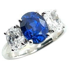 three stone blue and white diamond ring