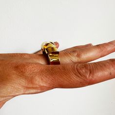 This was an exercise in patience. This ring is created out of a sheet of brass that I cut and split and wrapped back around. It's a sculptural and an unusual ring, but it's very comfortable to wear. About .75" wide at the bottom and varies around 1" at the top. Fabricated out of brass sheet and finished in 14k nickel free gold plate. Unusual Rings, An Exercise, At The Top, The Top, Split, Gold Plate, Ring Size, Brass, Sculpture