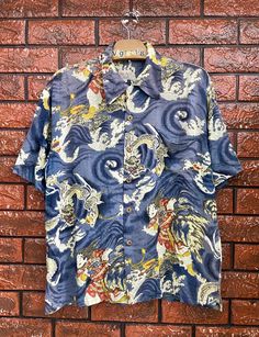 Vintage Japanese Button Down Rayon T Shirt Dragon Japanese Art Motif / Rockabilly Style / Japanese Fashion T Shirt Size M Condition : Good Used  Size on tag : M fit to L Colour : Blue Brand : Tabua Surf Measurement : Armpit to armpit - 22.5" Length - 26" Material : Rayon Made In: Japan THE SHIPPING (Your Choice Please read) 1. The shipping cost is USD 20 via Malaysian Registered Postage With Tracking Number. It will take 2-4 weeks or more for delivery, depends on your custom checking. 2. Add USD Vintage Short Sleeve Top With All Over Print, Blue Retro Hawaiian Shirt With Graphic Print, Vintage Blue Graphic Print Camp Shirt, Vintage Blue Camp Shirt With Graphic Print, Rockabilly Graphic Print Short Sleeve Top, Retro Blue Camp Shirt With Graphic Print, Retro Graphic Print Hawaiian Shirt, Retro Hawaiian Shirt With Graphic Print, Retro Short Sleeve Camp Shirt With All Over Print