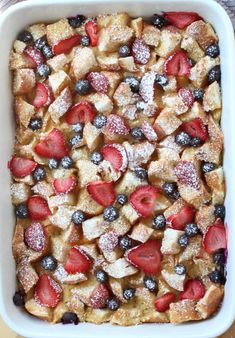 a casserole with strawberries and blueberries in it