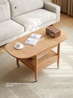 a coffee table sitting on top of a rug in front of a couch