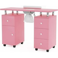 a pink desk with two drawers and a white toilet