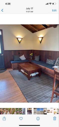 an image of a living room with wood paneling