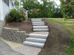 a set of stone steps leading up to a house