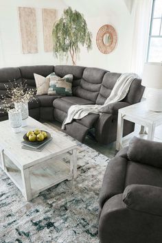 a living room with two couches and a coffee table