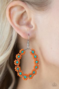 Dotted with mismatched multicolored, yellow, or orange beaded centers, a dainty collection of multicolored seed beaded floral frames are threaded along a wire hoop for a fabulous floral fashion. Earring attaches to a standard fishhook fitting. Shipping Warehouse, Moda Floral, Floral Frames, Orange Earrings, Beaded Earrings Patterns, Kids Earrings, Fish Hook Earrings, Color Naranja, Orange And Turquoise