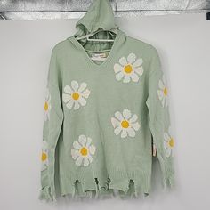 New With Tag Hazel Moon Size Medium 100% Acrylic Mint Knit Hoodie Sweater With Daisies And Distressing. Brand New With Hood! Measurements In Inches And Laid Flat 25" Across Shoulders 22" Across Chest Armpit To Armpit 25.5" Overall Length Green Cotton Sweater For Spring, White Hooded Spring Sweater, Spring Green Cotton Sweater, White Hooded Sweater For Spring, Spring Hooded Loungewear Sweater, Hooded Sweater For Spring Loungewear, Spring Loungewear Hooded Sweater, Spring Hooded Knitted Sweater, Cozy Cotton Sweater For Spring