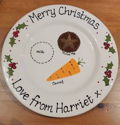 a white plate with christmas decorations and words on the front saying merry christmas love from harriet x