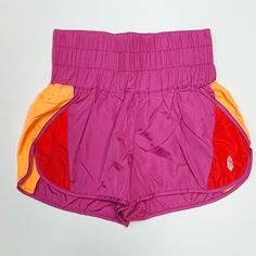 Note: This Colorway Arrived With A Strange Print Mark Around The Logo On The Front Of The Short. They Are Minor, But Price Reflects. Please Note This Before Purchasing. Thanks! Product Details Speed Up Or Slow Down In These Breezy, Warm-Up Style Running Shorts, Featuring A Boldly Smocked Waistband With A High-Rise Silhouette And Split Hem. Pull-On Style Stretch Waistband Relaxed Fit Fp Movement A Destination For The Life Well-Lived, Free People Movement Offers Performance-Ready Activewear, Pract Pink Nylon Bottoms With Built-in Shorts, Multicolor Athletic Shorts With Built-in Shorts, Stretch Color Block Bottoms, Short Shape, Stretch Color Block Short Bottoms, Stretch Color Block Bottoms In Short Shape, Pink Athletic Shorts With Elastic Waistband For Summer, Casual Pink Nylon Bottoms, Pink Nylon Athleisure Shorts, Pink Nylon Athletic Shorts For Summer