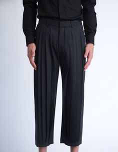 These tailored pleated pants are architectural, geometrical and crisp, yet at the same they are dynamic, full of volume and have a mesmerising movement. Pleating has been a key element in our latest collections, and all of our pleated items are treated and pleated individually. These pleated pants have front pleats that are closed at the hem, and are cropped above the ankle [full length and color options are available in the customisation section bellow]. Tailored from a soft polyester fabric, t Luxury Tailored Pants For Fall, Luxury Pleated Business Bottoms, Luxury Full-length Pants With Pockets, Luxury Pleated Black Pants, Luxury Pleated Bottoms For Office, Luxury Fitted Bottoms With Box Pleat, Luxury Fitted Pleated Pants, Luxury Full-length Pleated Pants, Luxury A-line Bottoms With Box Pleat