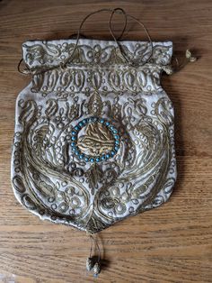 "Antique 18th century Ottoman Couching Embroidery bullion coin purse Tughra The purse measures 9.5\" long X 8.5\" wide.  (24cm X 21cm ) Excellent condition, looks unused Slight fading to the interior satin by opening" Gold Embroidered Bags For Ceremonial Occasions, Gold Pouch Bag For Ceremonial Occasions, Traditional Embroidered Potli Bag For Ceremonial Occasions, Traditional Rectangular Potli Bag With Gold Embroidery, Traditional Gold Potli Bag For Ceremonial Occasions, Traditional Embroidered Potli Bag For Ceremonies, Traditional Embroidered Potli Bag For Ceremonial Use, Ceremonial Gold Potli Bag For Festivals, Ceremonial Embroidered Potli Bag For Festivals