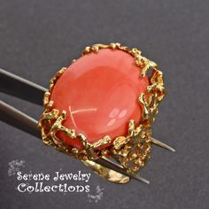 This pretty Japanese Momo Coral Ring is set in 14k solid gold with fancy shank design. Ring Size: 6.75 Total Weight: 16.75 grams Precious Metal: 14k solid gold Precious stones: -Coral Center Stone: 25mm x 19.8mm 14k Gold Cabochon Jewelry For Anniversary, Yellow Gold Oval Cabochon Rings For Formal Occasions, Formal Yellow Gold Oval Cabochon Rings, Formal Yellow Gold Cabochon Jewelry, Anniversary 14k Gold Cabochon Jewelry, Exquisite Yellow Gold Collectible Rings, Exquisite Yellow Gold Oval Cabochon Ring, Exquisite Oval Cabochon Yellow Gold Ring, Collectible Yellow Gold Jewelry With Oval Cabochon