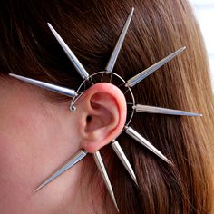 No piercing needed to wear this large statement spiked ear cuff. It's very lightweight, comfortable and easy to wear - great gift idea for punk and rock lover. The length of acrylic spikes is 2 in (5 cm). The spikes are made of smooth material, they are safe and not sharp. Ear cuff is made from silvery jewelry wrap. The price is for 1 ear cuff. An unusual ear cuff no piercing required can be used for left or right ear. The top piece is adjustable to hug even the smallest of ears. SPIKED jewelry Punk Jewelry With Spikes For Alternative Fashion, Punk Jewelry With Spikes For Concerts, Punk Jewelry With Spikes, Punk Spiked Jewelry For Concerts, Edgy Spiked Jewelry For Festivals, Edgy Festival Jewelry With Spikes, Punk Style Studded Jewelry For Festival, Edgy Spiked Jewelry For Concerts, Silver Spiked Jewelry For Alternative Fashion