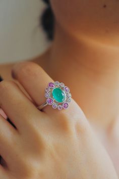 a close up of a person's hand with a ring on it