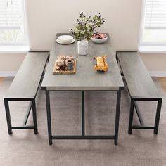 a table with two benches and some food on it