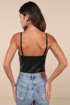 Going-out? Make sure you slip on the Lulus Sleek Vibes Black Vegan Leather V-Neck Sleeveless Bodysuit for a night of compliments! Smooth faux leather shapes this ultra-flirty bodysuit with adjustable spaghetti straps, a V-neckline, and a triangle-style bust. Figure-fitting bodice finishes with attached, mesh thong bottoms with snap closures. Fit: This garment fits true to size. Length: Size medium measures 23" from adjustable straps to hem. Bust: Great for any cup size. Waist: Fitted - very fitt Chic Lined Tank Top For Night Out, Chic Sleeveless Lined Camisole, Chic Sleeveless Lined Tops, Fitted Cami Bodysuit For Night Out, Spring Camisole Bodysuit For Night Out, Tank Bodysuit For Party, Sleeveless Lined Tank Top For Spring, Spring Sleeveless Tank Top With Lined Body, Spring Sleeveless Lined Tank Top