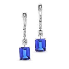 These magnificent emerald cut tanzanite dangling earrings, resembles royalty. Elegant and stylish, these tanzanite earrings are set in 18K white gold, and are adorned with two natural blue emerald cut tanzanite gems, as the center stones. The blue tanzanites are complemented by the array of white diamonds all along the center of the English Lock. The finishing touch to these beauties is the elegant round brilliant white diamonds which sit just above the blue tanzanite adding that extra sparkle. Diamond Dangling Earrings, Tanzanite Drop Earrings, Royal Blue Sapphire Ring, Emerald Earrings Drop, Tanzanite Earrings, Round Solitaire, Diamond Dangle Earrings, Blue Tanzanite, Orange Sapphire