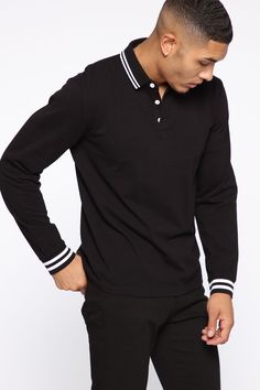 Available In Black, Olive, Camel, Purple, White, Grey, And Navy Fold Down Collar 3 Button Closure Long Sleeve 100% Cotton Imported | Mens Wilson Long Sleeve Polo in Black size Small by Fashion Nova Sporty Black Top With Collar, Fitted Black Polo Shirt With Striped Collar, Sporty Long Sleeve Black Polo Shirt, Black Winter Top With Striped Collar, Black Top With Striped Collar For Winter, Winter Black Top With Striped Collar, Black Cotton Top With Ribbed Collar, Black Shirt With Striped Collar, Black Casual Polo Shirt With Striped Collar