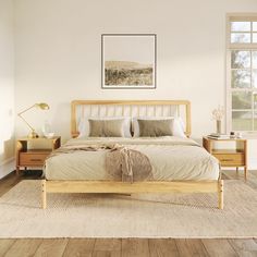 a bedroom with white walls and wooden furniture