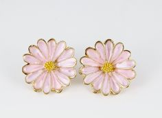 -enamel flower post earrings  -pink flower pendant with yellow and gold center -the flower is 7/8" wide -metal post / stick / stud with rubber stopper closure -lightweight Pink Enamel Flower-shaped Earrings, Pink Flower-shaped Enamel Earrings, Pink Flower Enamel Earrings, Gold Clip-on Earrings For Spring Gift, Spring Flower Enamel Earrings, Nickel-free Enamel Flower Earrings, Gold Flower Clip-on Earrings For Spring, Vintage Gold Flower Earrings For Spring, Gold Vintage Flower Earrings For Spring