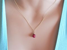 "ruby necklace gold ruby jewelry ruby drop necklace July birthstone gift for wife necklace for women necklace silver ruby pendant gold A gorgeous real ruby pendant necklace. The ruby is drop shape and it is wire wrapped in a dainty way. The chain is diamond cut which means that reflects the light and it gives a sparkling touch to the necklace and your look. Ruby is July's birthstone so it is perfect as a birthday gift for those who celebrate their birthday in July and it is perfect for the Zodia Minimalist Ruby Jewelry As Gift, Minimalist Ruby Jewelry As A Gift, Elegant Wire Wrapped Necklaces For Valentine's Day, Dainty Gold Ruby Jewelry, Oval Drop Necklace Fine Jewelry Gift, Ruby Teardrop Pendant Necklace As Gift, Gold Ruby Teardrop Pendant Jewelry, Ruby Drop Necklace For Gift, Dainty Ruby Pendant Necklace