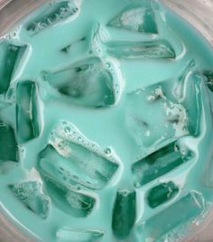 an image of ice cubes with green liquid