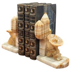 three bookends made out of wood and marble