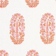 an orange and pink floral pattern on white fabric