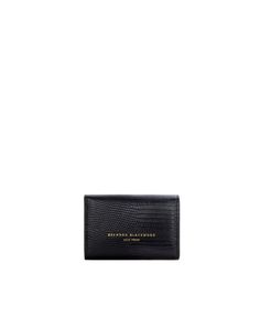 Our Neema Key Pouch in Black Lizard Embossed Leather Designed in New York Black Pouch Clutch With Card Slots, Black Wallet With Coin Pocket, Black Rectangular Pouch With Card Slots, Black Wallet With Coin Pocket In Pouch Shape, Black Clutch Pouch With Card Slots, Black Coin Purse With Interior Card Slots, Black Pouch Coin Purse With Interior Card Slots, Classic Black Coin Purse With Removable Pouch, Black Compact Coin Purse With Removable Pouch