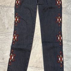 Elevate Your Denim Game With These Melrose And Market Skinny Jeans. The Gray Washed Denim With An Aztec Embroidered Logo And Fringe Accents Add A Touch Of Bohemian Flair To Any Outfit. The Waist Size Is 26 And Has A Zip Closure For Easy Wear. These Jeans Are Machine Washable And Have A Slimming Effect With Their Unique Fit. The Dark Wash Fabric Makes Them Perfect For Any Season, Whether It's Winter, Summer, Fall, Or Spring. These Jeans Are A Must-Have For Any Fashion-Forward Woman's Wardrobe. De Bohemian Mid-rise Fitted Jeans, Bohemian Style Fitted Mid-rise Jeans, Bohemian Fitted Mid-rise Jeans, Fitted Bohemian Dark Wash Jeans, Embroidered Mid-rise Fitted Jeans, Mid-rise Embroidered Fitted Jeans, Fitted Mid-rise Embroidered Jeans, Embroidered Dark Wash Jeans For Fall, Fitted Cotton Jeans With Multicolor Embroidery