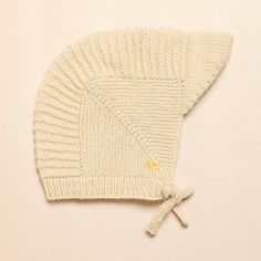 Introducing our Pioneer hand knit wool cap with an extended visor, a cozy and practical accessory for your little one. Crafted from premium wool and meticulously hand knit by skilled artisans, this cap combines warmth with timeless style. Premium Wool Construction: Made from high-quality wool, our Pioneer cap offers exceptional warmth and softness, ensuring comfort for your baby in cooler weather. Extended Visor: The extended visor provides added protection from sunlight and light rain, keeping your baby's eyes shaded and face shielded during outdoor outings. Handcrafted Excellence: Each cap is lovingly hand knit by skilled artisans, resulting in a unique, one-of-a-kind piece that showcases superior craftsmanship. Chin Tie: Equipped with a soft chin tie, this cap ensures a secure and comfo Baby Eyes, Wool Caps, Light Rain, Baby Head, Cooler Weather, Face Shield, Comforters Cozy, Out Of Style, Timeless Style