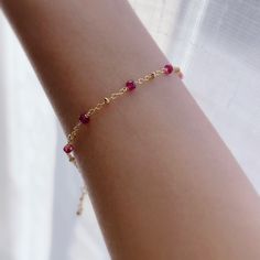 "* DETAILS* This dainty bracelet is a perfect gift to the one you love or to yourself. A nice every day bracelet. - AAA+ Natural Ruby Beads - 24k Gold Filled Chain - 14K GOLD FILLED Wire - 14k Gold Filled Spring Ring Clasp - 14k Gold Filled Link Rings - Bracelet has a 1\" Extension with gold filled ball charm. ✨All components are gold filled. 👉🏻For more birthstone bracelets, see https://www.etsy.com/shop/JinnysJewelryBySeJin You may also like 🌟Sapphire Bracelet. https://www.etsy.com/JinnysJew Adjustable Beaded Bracelet With Delicate Chain For Gift, Delicate Bracelets With Tiny Beads, Dainty Crystal Bracelet With Tiny Beads For Gift, Dainty Bracelets For Birthday Gift, Dainty Hypoallergenic Bracelets As Birthday Gift, Dainty Hypoallergenic Bracelets For Birthday Gift, Dainty Everyday Crystal Bracelet, Dainty Hypoallergenic Bracelet For Birthday Gift, Dainty Hypoallergenic Bracelet For Birthday