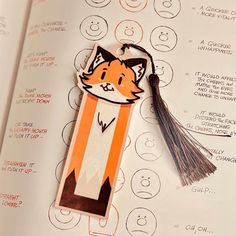 an orange and white bookmark with a cat on it