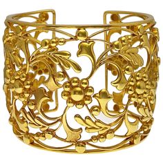 This 18 karat and 22 karat yellow gold cuff bracelet has a floral motif inspired by 18th century designs. The piece is timeless and feminine and can easily be worn with jeans and a tee shirt or an evening gown. The brushed gold draws upon Grecian, Romanesque and 18th century influences. This cuff measures approximately 2" wide. Yellow Gold Cuff Bracelet, Jewellery Watch, Indian Gold Jewellery Design, Large Cuff Bracelet, Gold Bangles Indian, Antique Bracelets, Wide Cuff Bracelets, Gold Pendant Jewelry, The Bangles