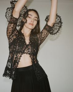 The Colette lace blouse features a delicate fitted V neckline top with ¾ sleeves and Venise lace collage all thru-out. The Colette comes with a lace bralette. Cotton and Rayon tulle lace Five satin buttons along bustline center front Dry clean only Each piece is made to order and handcrafted in our atelier. Slight variations may occur as each piece is unique. Lace Mesh Top With Lace Trim For Night Out, Sheer Sleeves Lace Top For Night Out, Party Mesh Top With Lace Trim, Fitted Lace Mesh Top With Lace Trim, Black Lace Mesh Top, Delicate Lace Top For Night Out, Black Lace Party Tops, Black Lace Tops For Party, Sheer Lace Top For Party