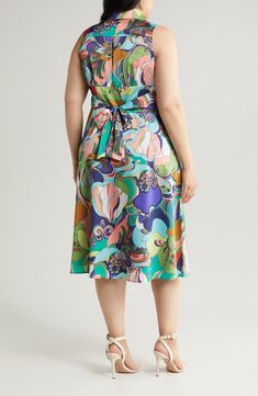 A vibrant retro print enlivens this rich satin midi designed in a sleeveless silhouette with a surplice V-neck and a shaping back tie. 47" length (size 1X) Spread collar Surplice V-neck Sleeveless Side-seam pockets Attached back sash Lined 100% polyester Dry clean Imported Multicolor Midi Sleeveless Dress For Garden Party, Sleeveless Multicolor Silk Midi Dress, Multicolor Sleeveless Silk Midi Dress, Sleeveless Satin Printed Dress, Multicolor Silk Sleeveless Midi Dress, Retro Sleeveless Midi Dress For Garden Party, Sleeveless Retro Print Dress For Garden Party, Sleeveless Dress With Retro Print For Garden Party, Chic Sleeveless Midi Dress With Vibrant Print