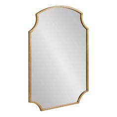 a gold framed mirror with an arched design on the top and bottom half, against a white background