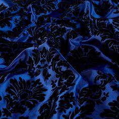 a blue and black fabric with an intricate design