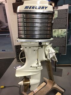 an old boat engine sitting on display in a museum