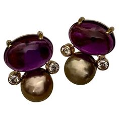 For Sale on 1stDibs - Cabochon amethyst are paired with lavender pearls in these classic button style earrings. The amethyst (origin: Brazil) are the deepest and the richest Luxury Silver Cabochon Earrings, Luxury Statement Beads, Gems, And Cabochons, Luxury Gold Cabochon Pearl Earrings, Luxury Ornate Cabochon Earrings, Luxury Vintage Cabochon Earrings, Luxury Purple Multi-stone Earrings, Elegant Purple Gemstone Pearl Earrings, Elegant Purple Cabochon Earrings, Purple Oval Earrings With Gemstone Accents