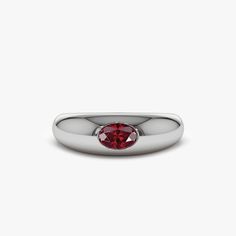 a white gold ring with a red stone