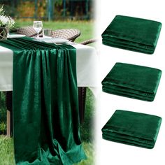 four pieces of green velvet table cloth sitting on top of a white table in the grass